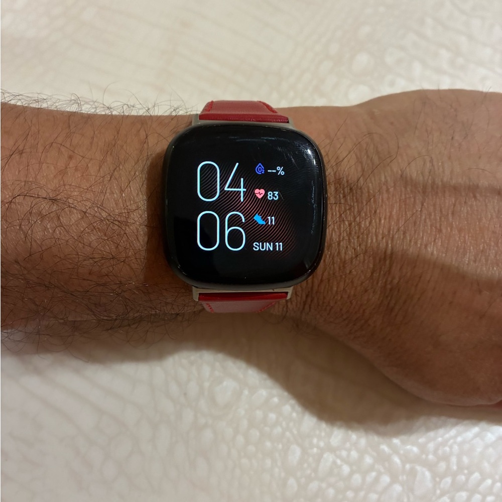Fitbit Smartwatch with Red Strap